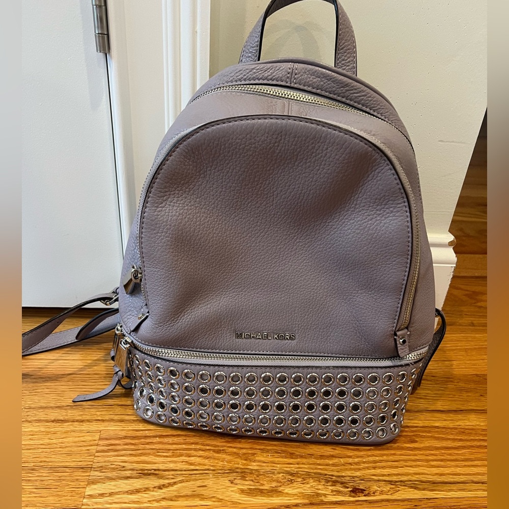 Purple Michael Kors backpack.